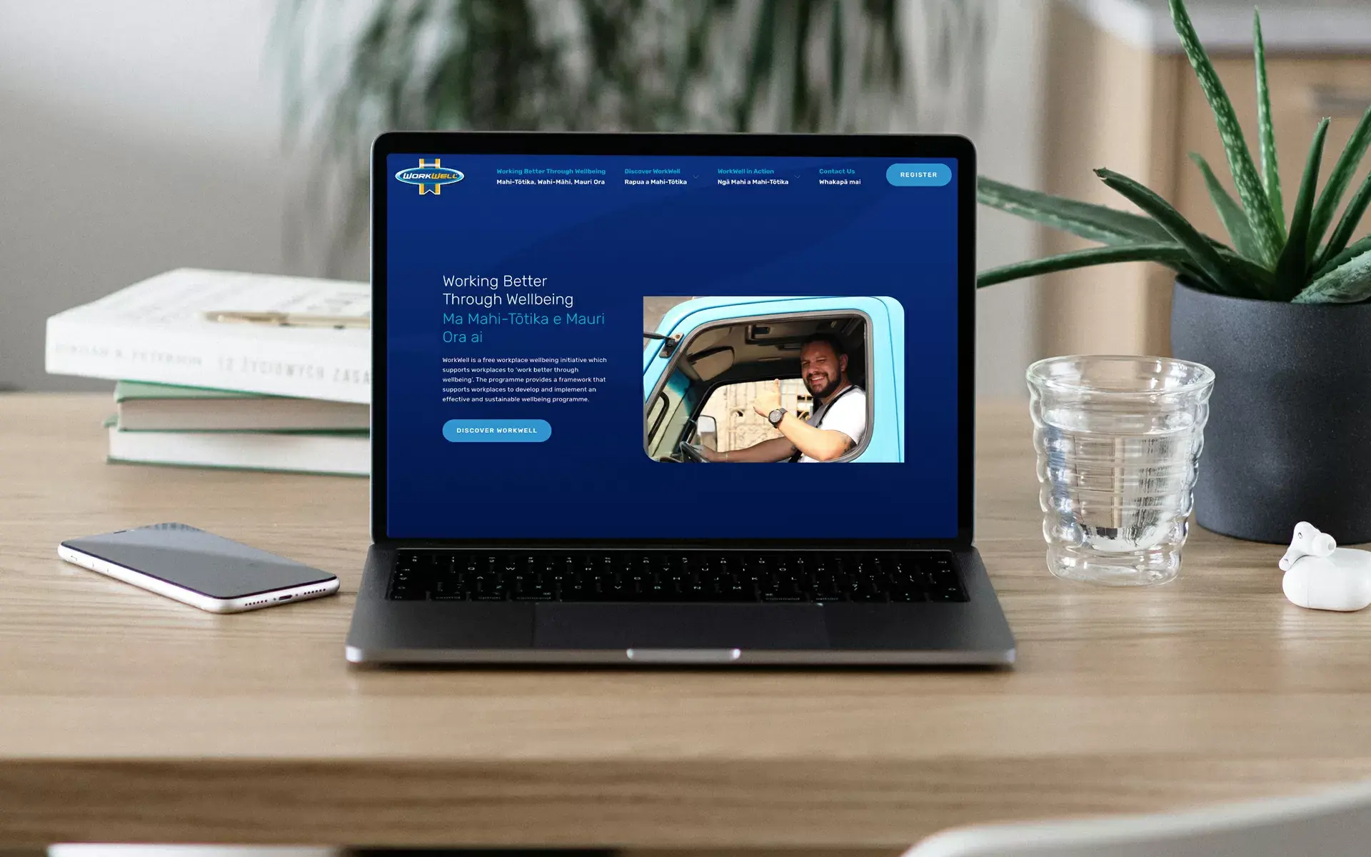 A mock-up of the homepage for the Workwell website shown on a laptop screen